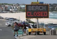 Australia on track to see coronavirus largely gone by July, sport resumes