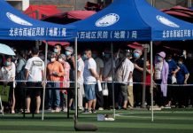 China eases lockdown in Beijing as mass testing gathers pace