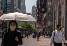 China puts half a million in lockdown, Beijing fights virus